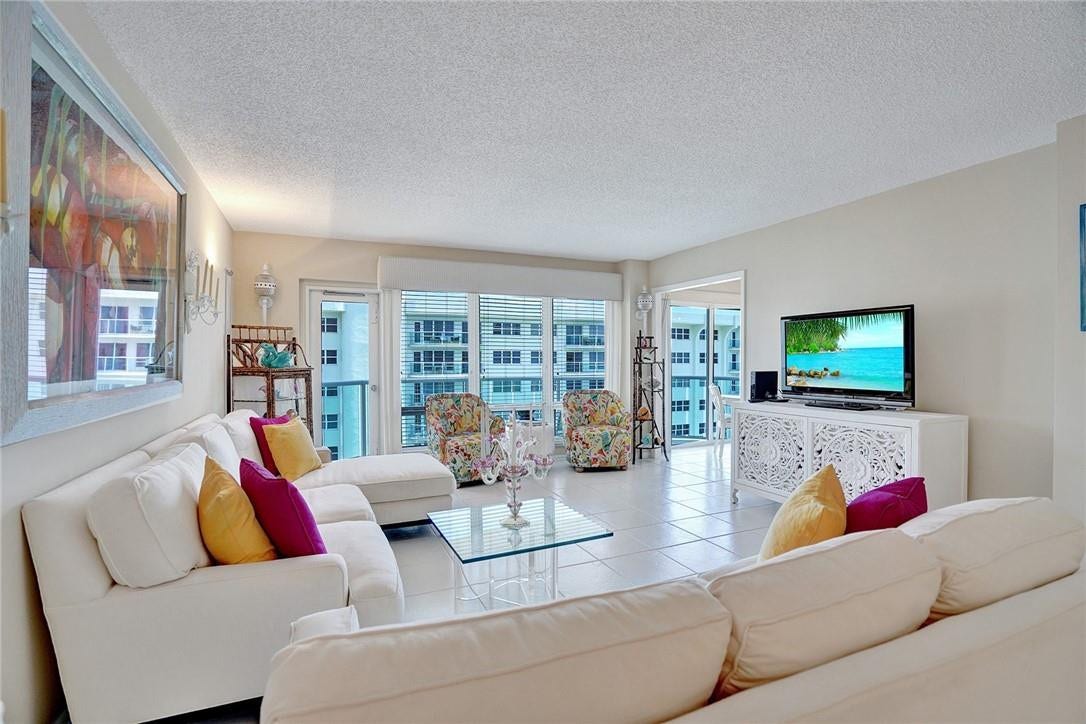 The balcony is accessible two ways; by the balcony door to the left of the windows or from the sliding door in the kitchen.