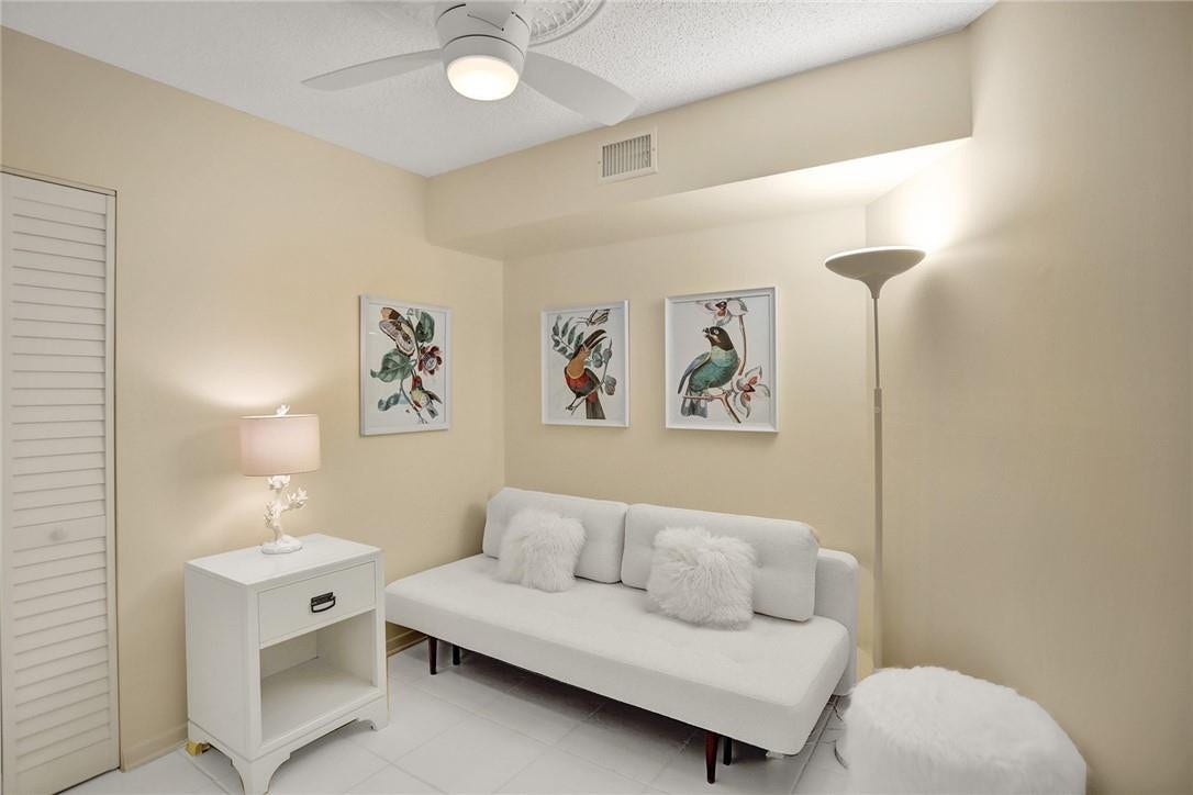 Here is a prior photo when the owner had the bonus room furnished. The couch opened up to a queen sized bed. There is a closet behind the louvered doors on the left. The furniture has been removed.