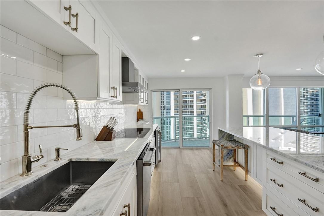 The beachy looking flooring is porcelain tile, and it runs thru out all of the main living areas.