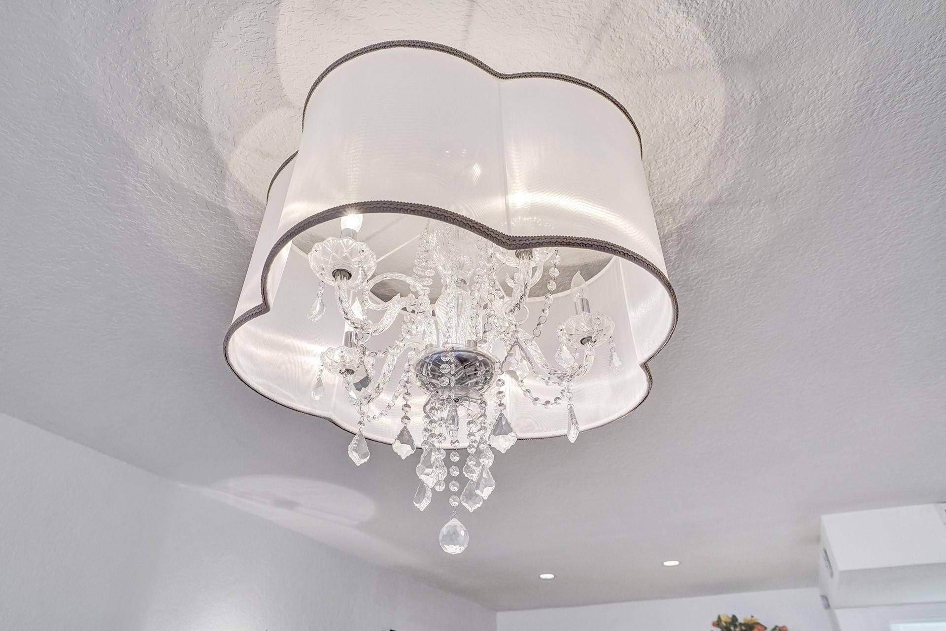 Beautiful light fixture over the king size bed.