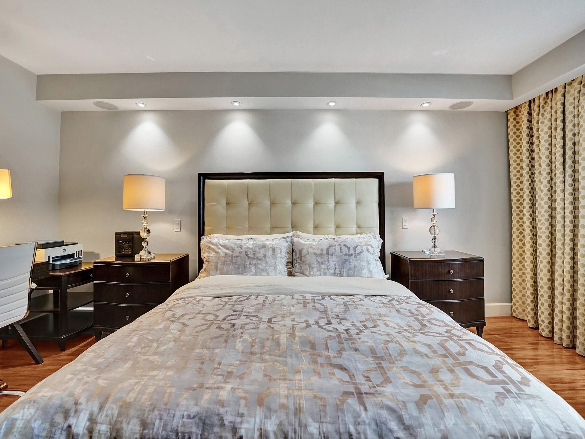 Recessed lighting over the bed.