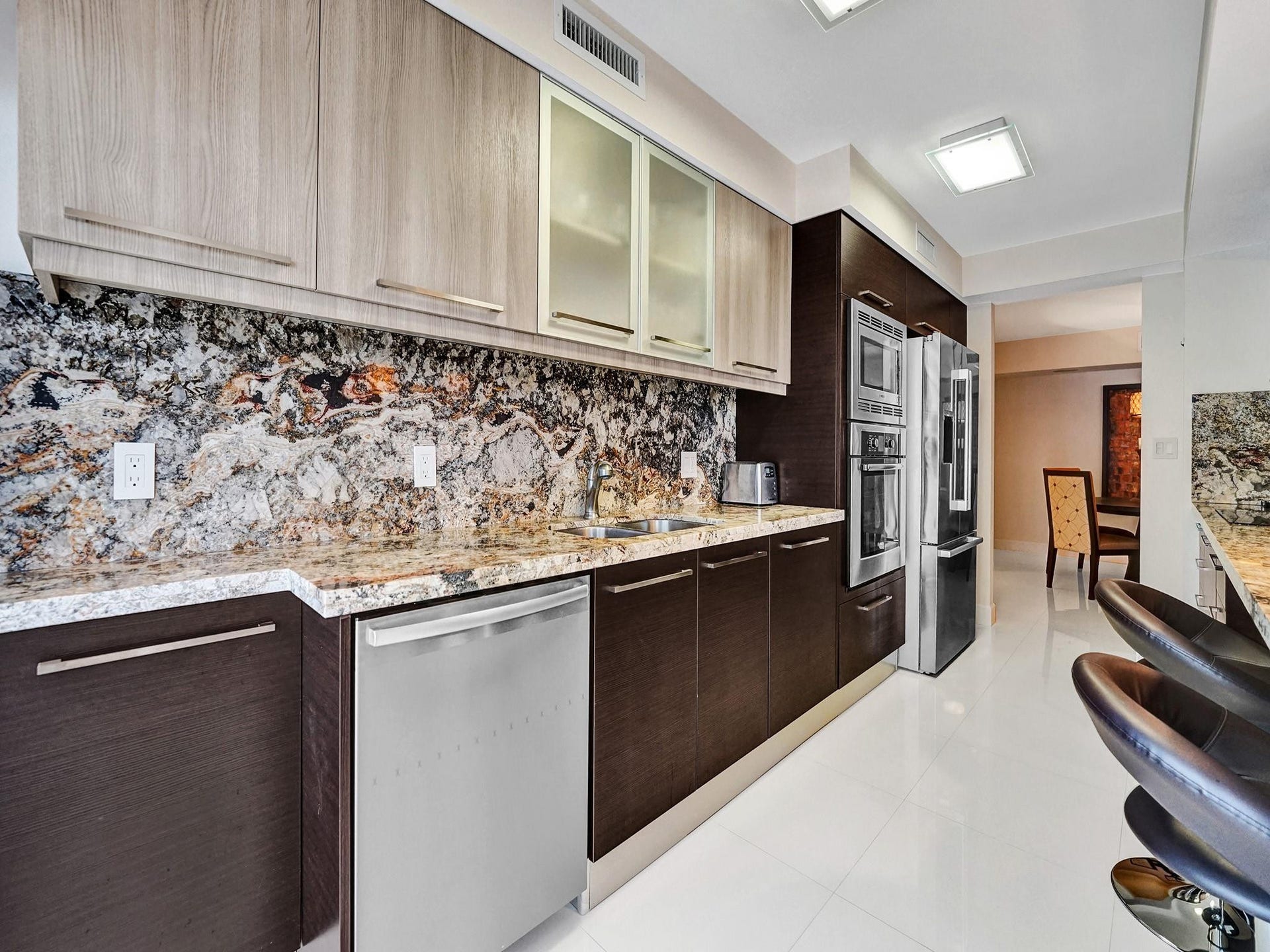 The kitchen features all Bosch appliances. The refrigerator is a few months old.