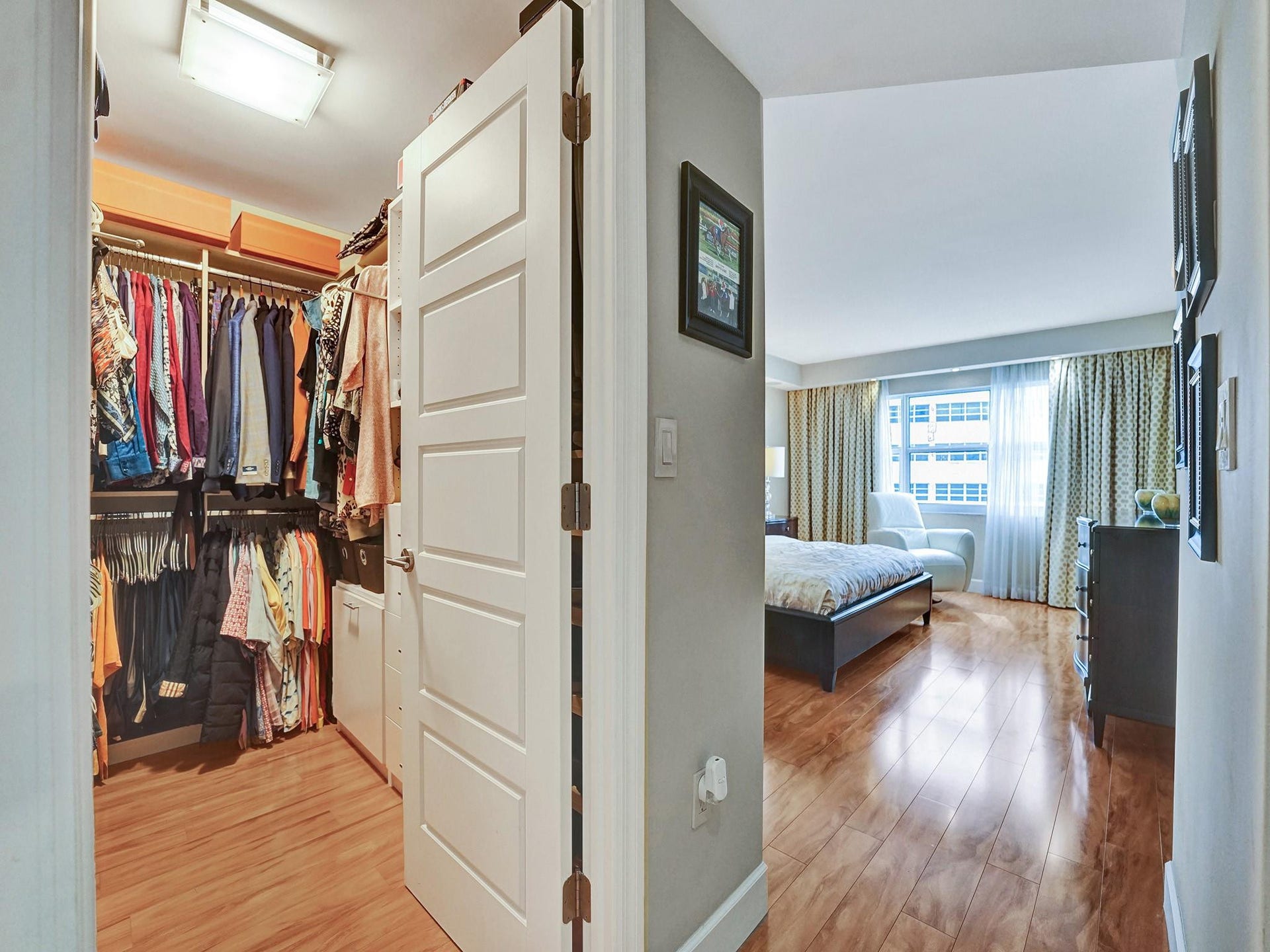 As you enter the primary bedroom, the renovated primary closet is on your left.