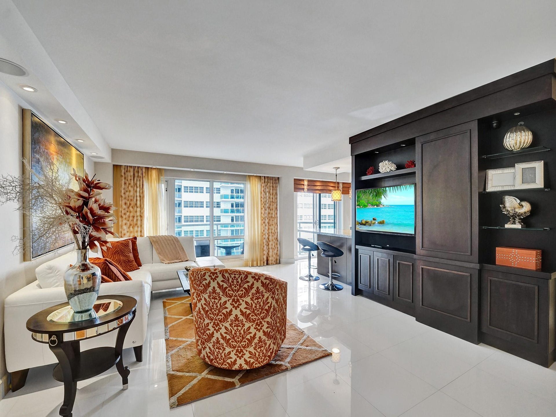 The custom built wall unit houses a surround sound media system.