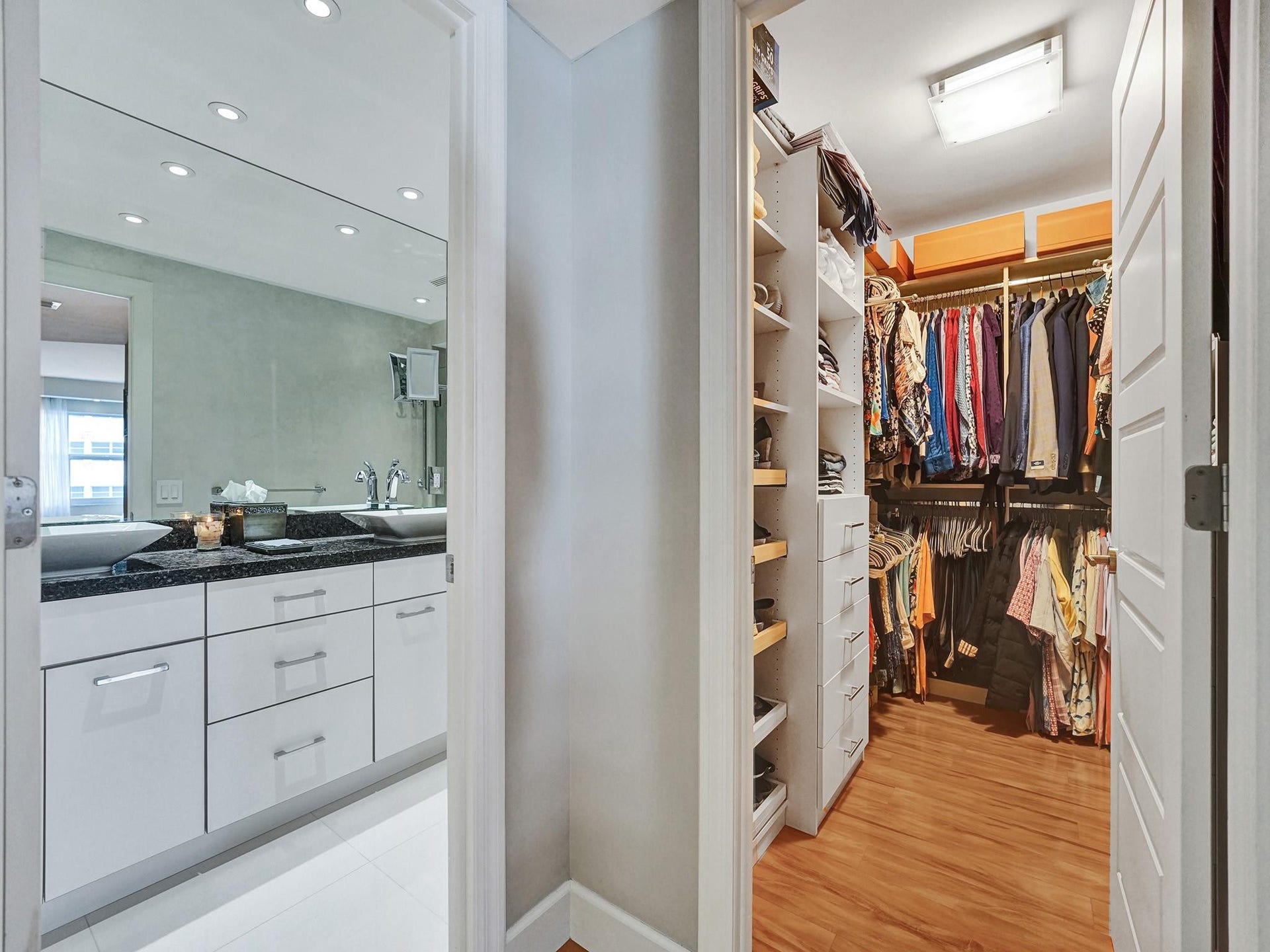 As you enter the primary bedroom area, the primary bathroom is on the left, and the primary walk in closet is in front of you. The bedroom is to the right of the closet.