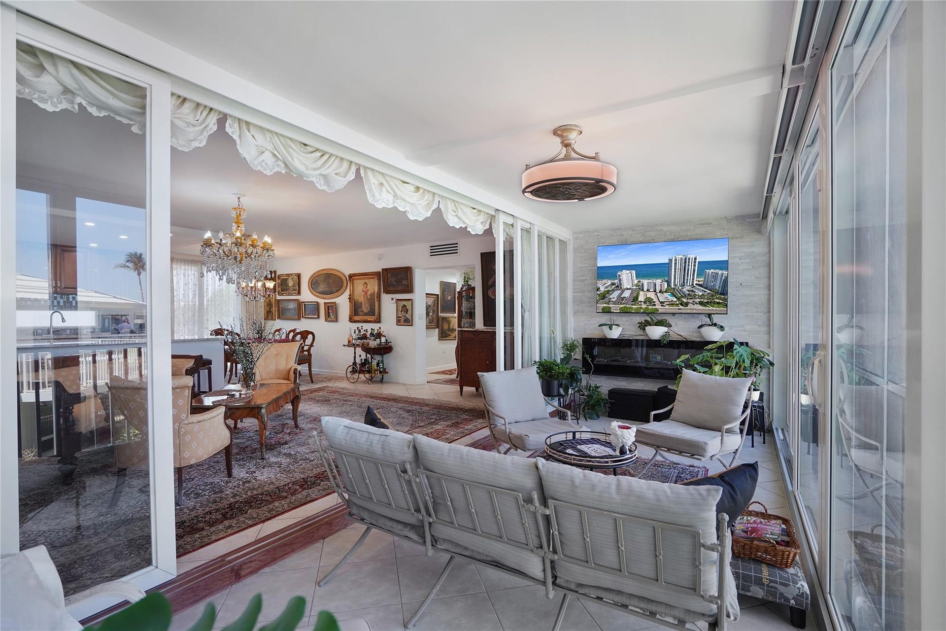 1530 S Ocean Boulevard, #203, Lauderdale By The Sea, FL 33062 The 65" flat screen tv and the working fireplace located on the marble wall will convey with the sale.