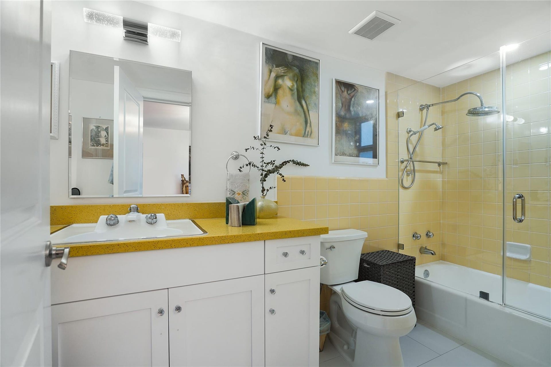1530 S Ocean Boulevard, #203, Lauderdale By The Sea, FL 33062 The owner kept the shower tiles but updated the primary bathroom with quartz countertops and new fixtures.