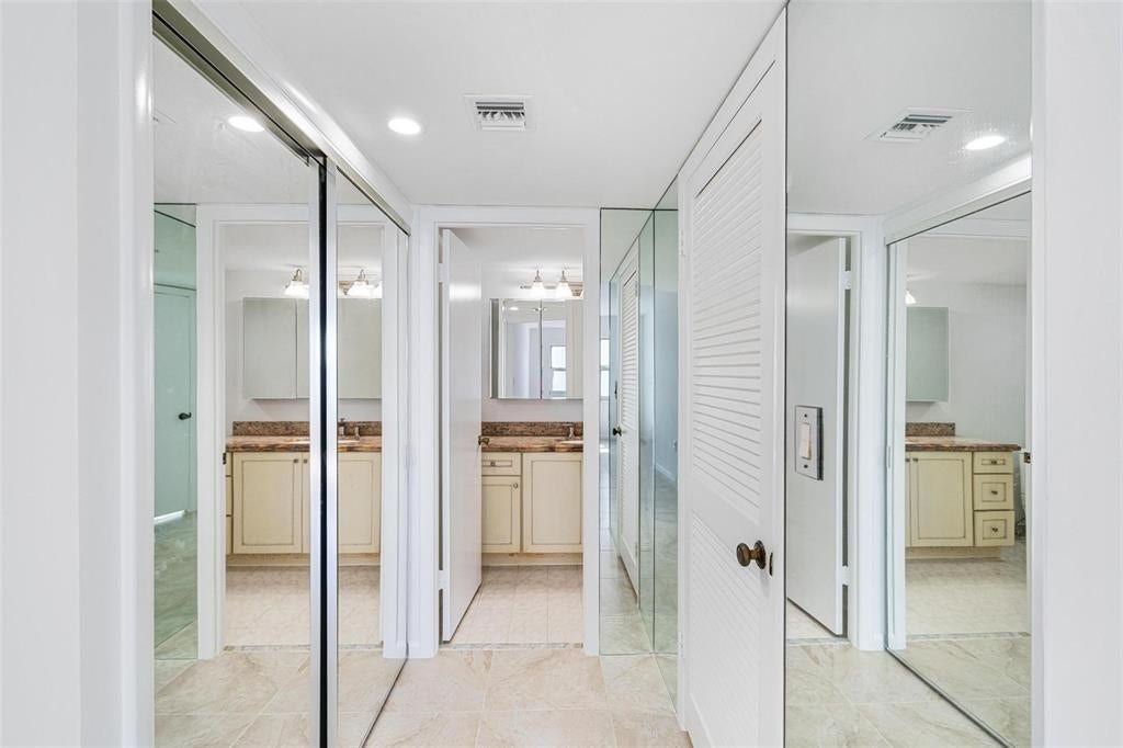 The primary bedroom has an en suite bath. The door to the right leads in to the walk in closet.