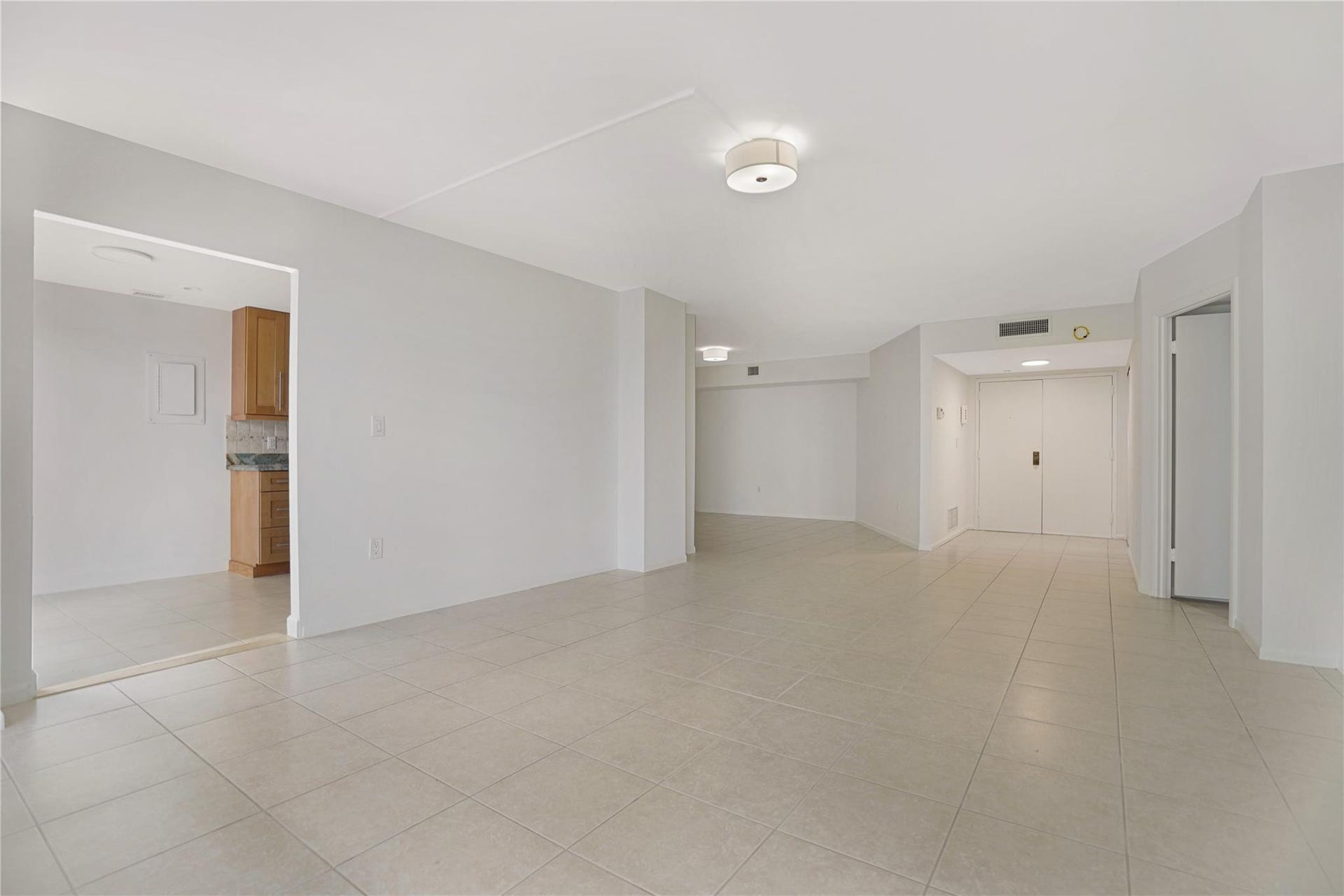 With your back to the ocean view, this is facing towards the front door. The dining room is at the top left.