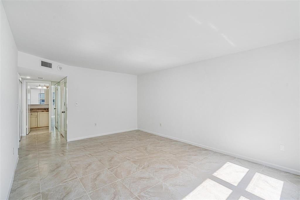 The primary bedroom, facing into the primary bath.