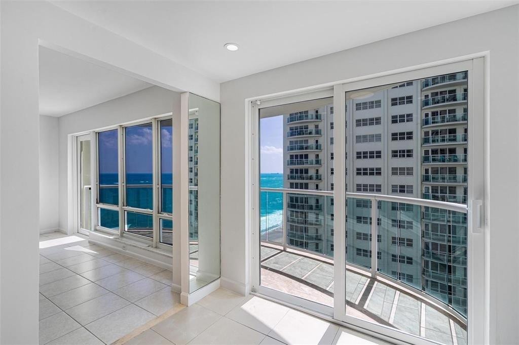 The kitchen has an eat in area. The sliding door leads out to the balcony.