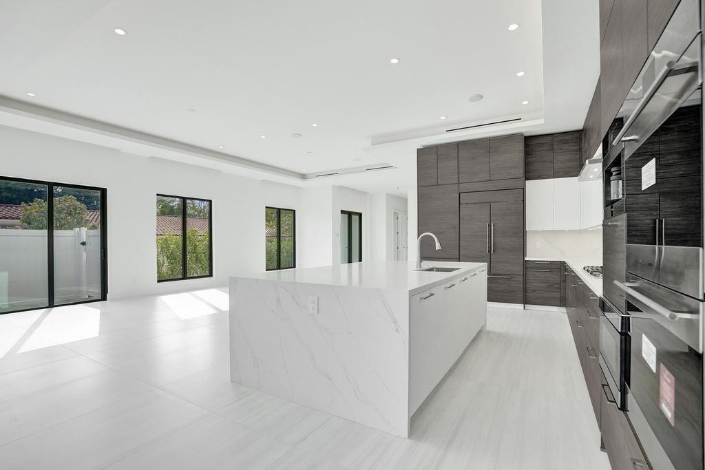Entertaining Flow is Natural, as the kitchen is aligned with the dining and living areas for seamless first-floor entertaining.