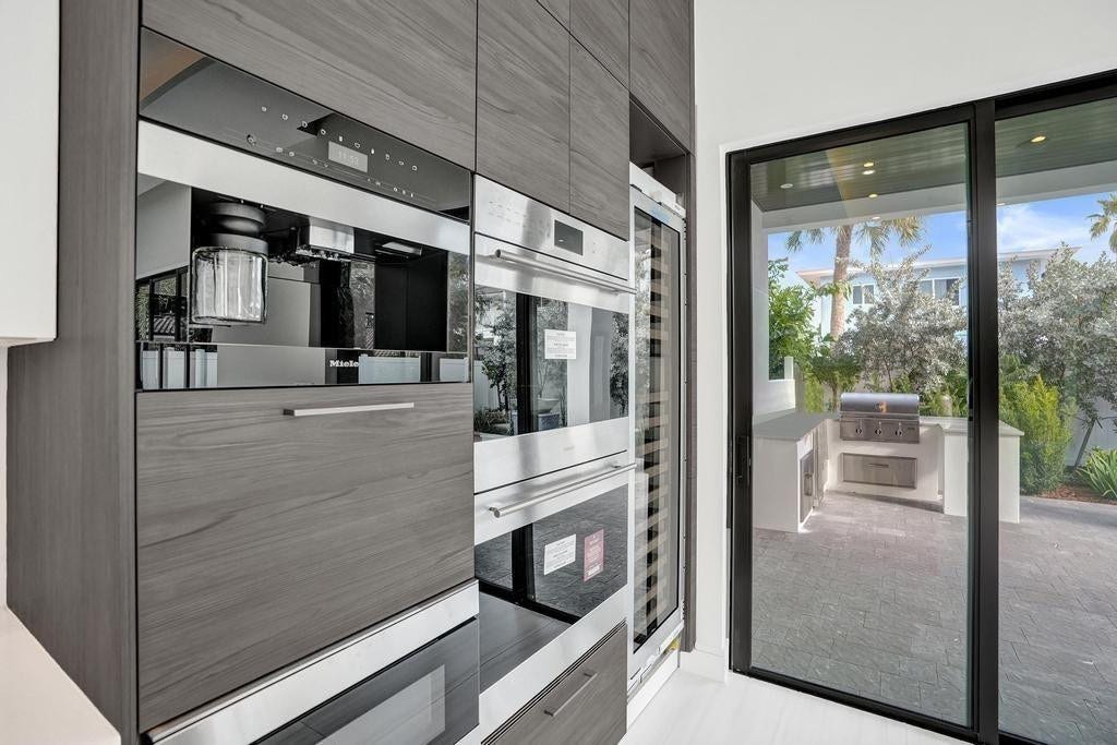 Chefs Kitchen.. Gas Cooktop, Double Ovens, and Espresso Maker, Oversized Wine / Beverage Cooler.