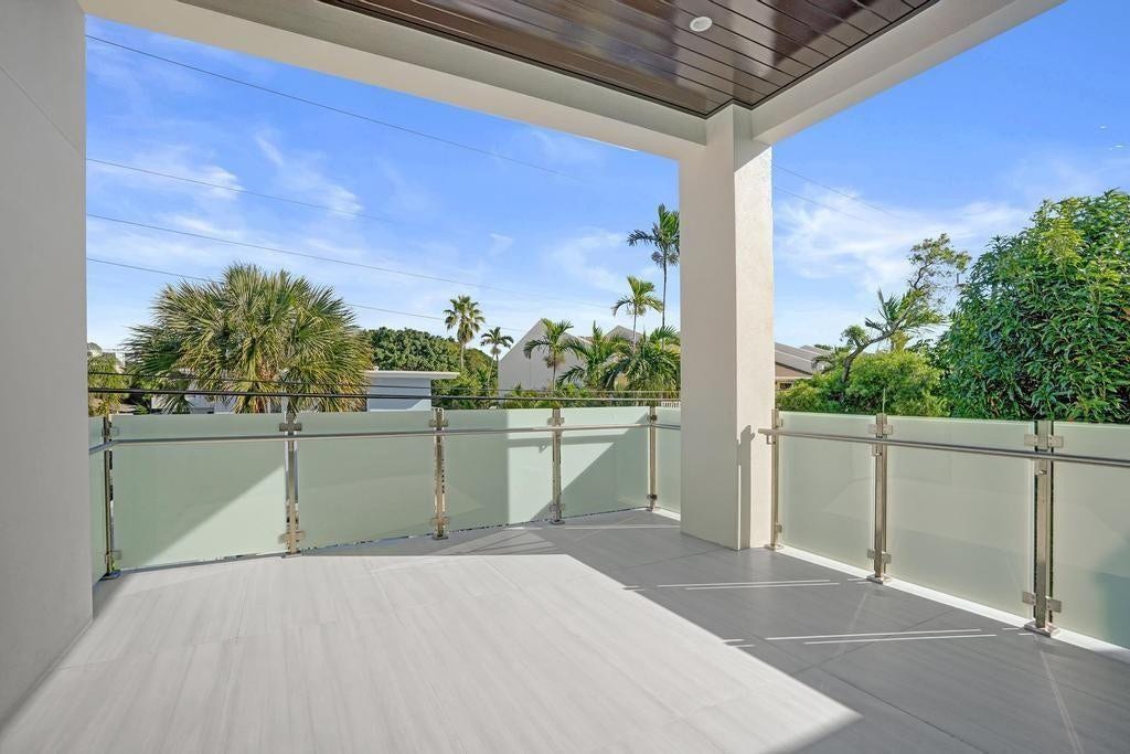 Primary Suite Balcony  Private east-facing retreat overlooking the pool, designed as a true outdoor living space for quiet mornings and relaxed evenings. - Intentionally designed as a private sanctuary perfect for unwinding, entertaining quietly, or starting and ending the day in a peaceful, resort-style setting.