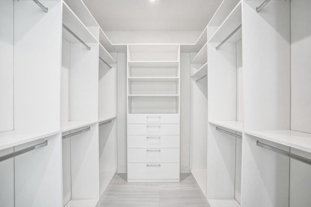 Primary Suite Closets  Dual walk-in closets, each individually configurable to suit personal style and storage needs, offering everyday convenience and personal space.