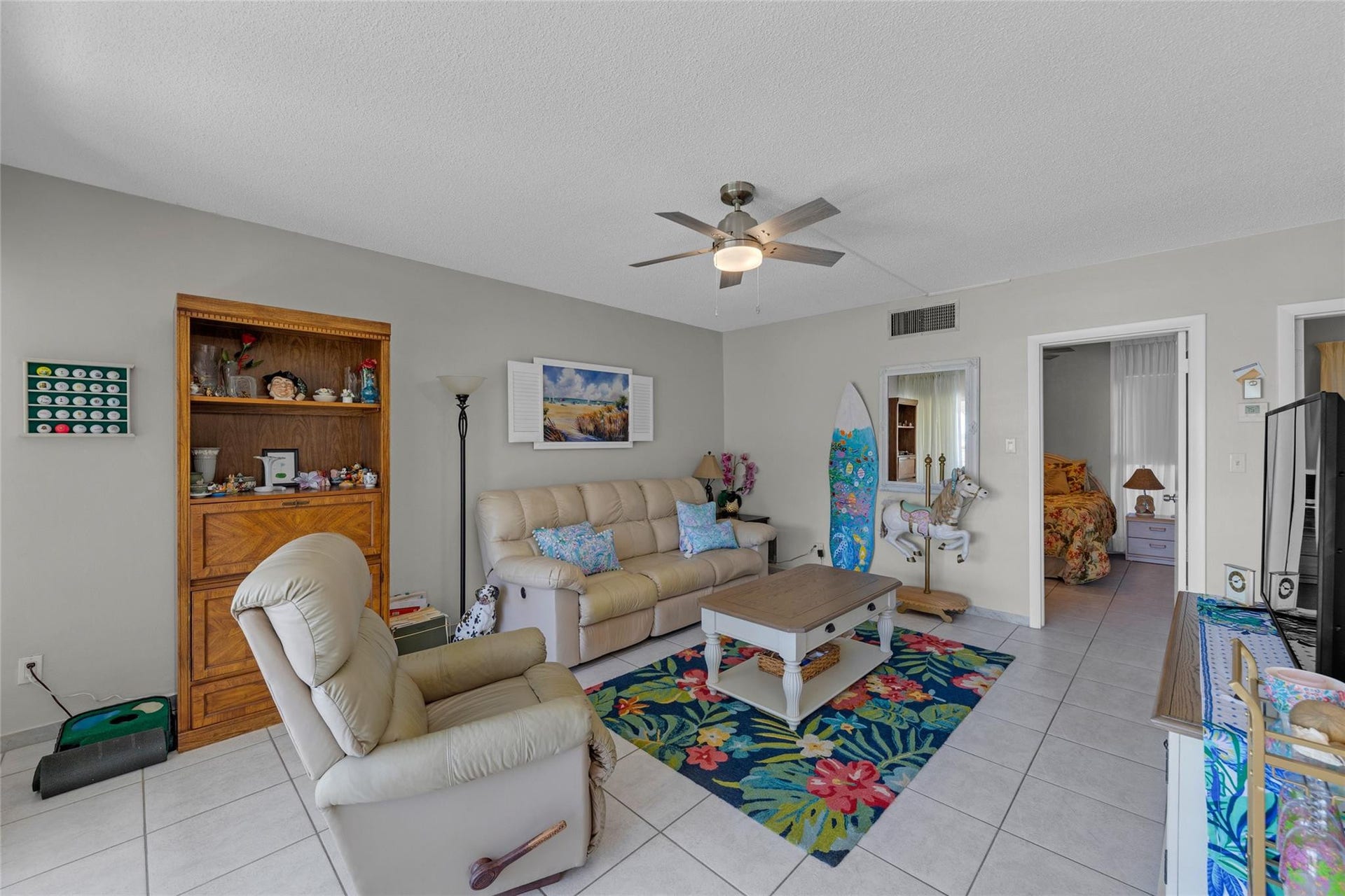 Living room is spacious and offers tile flooring