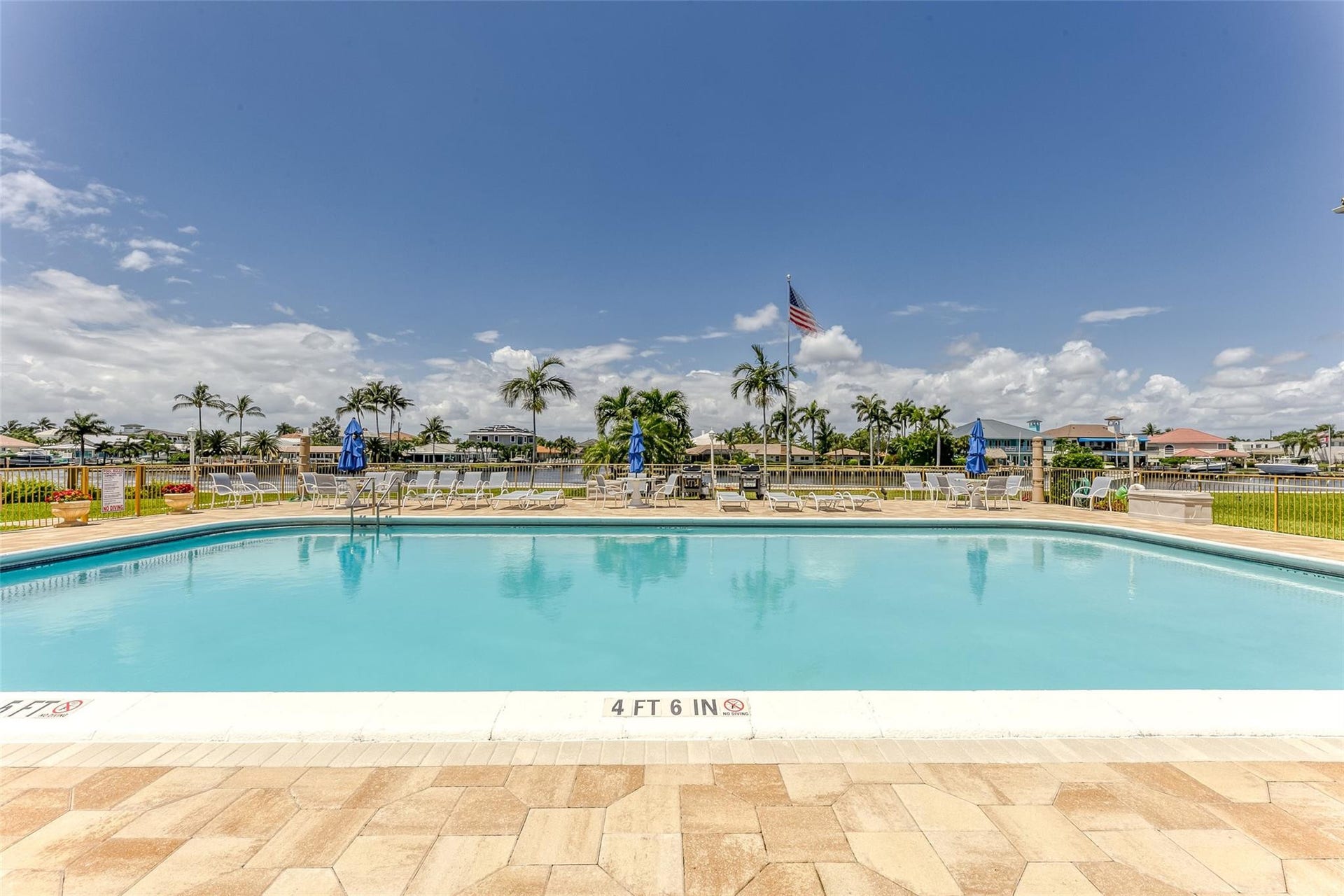 Beautiful community pool located right on the water is the perfect place to swim and sun