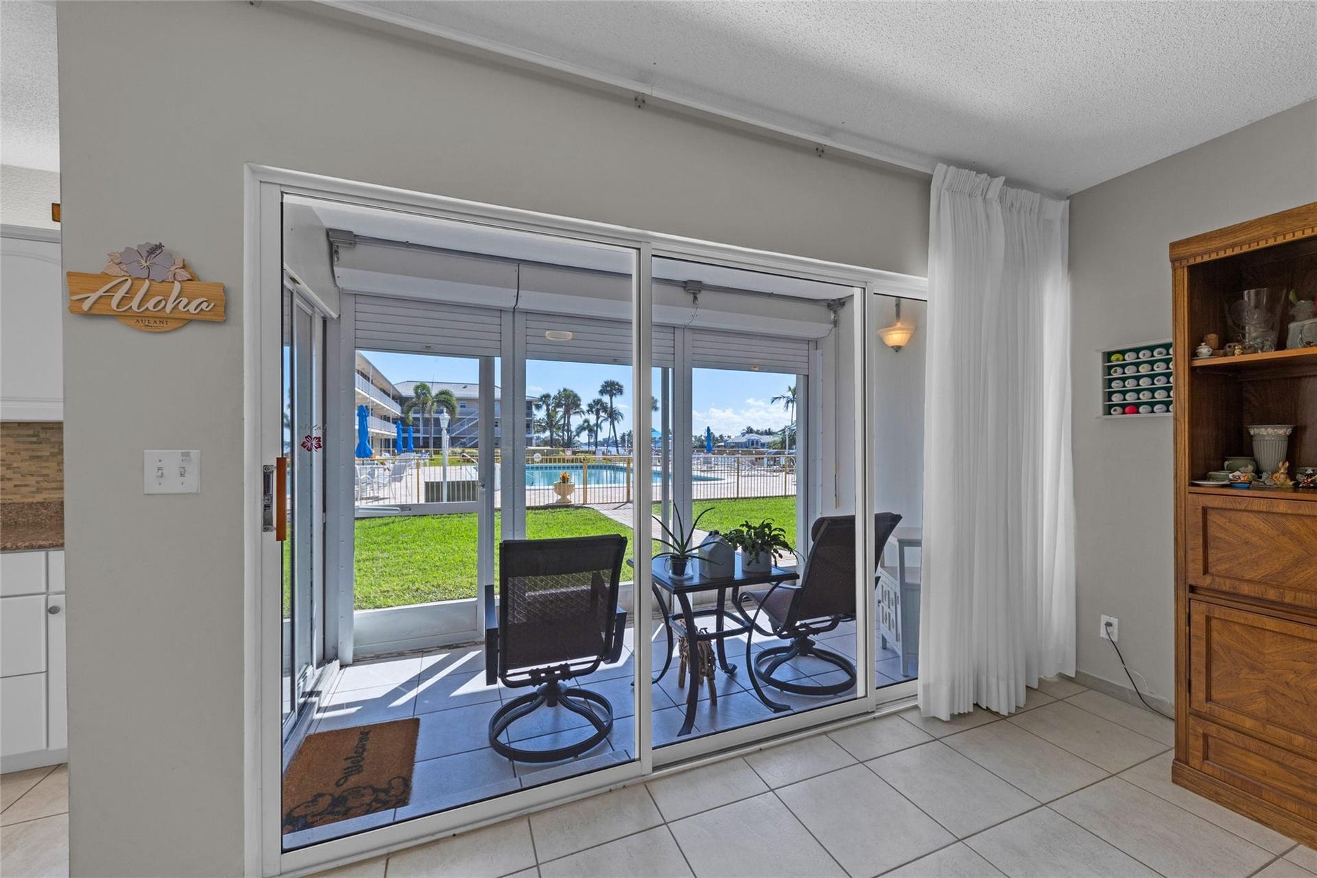 Screened patio with sliders into living room