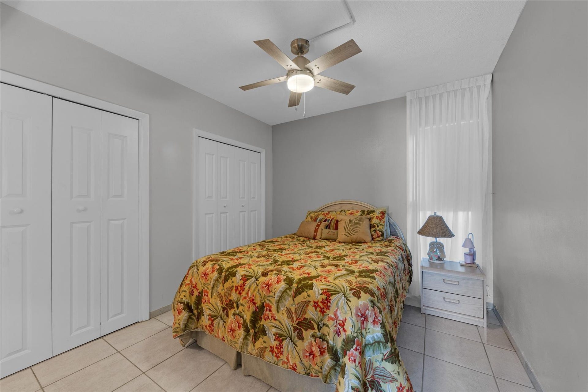 Second bedroom offers double closets and overhead ceiling fan with lighting