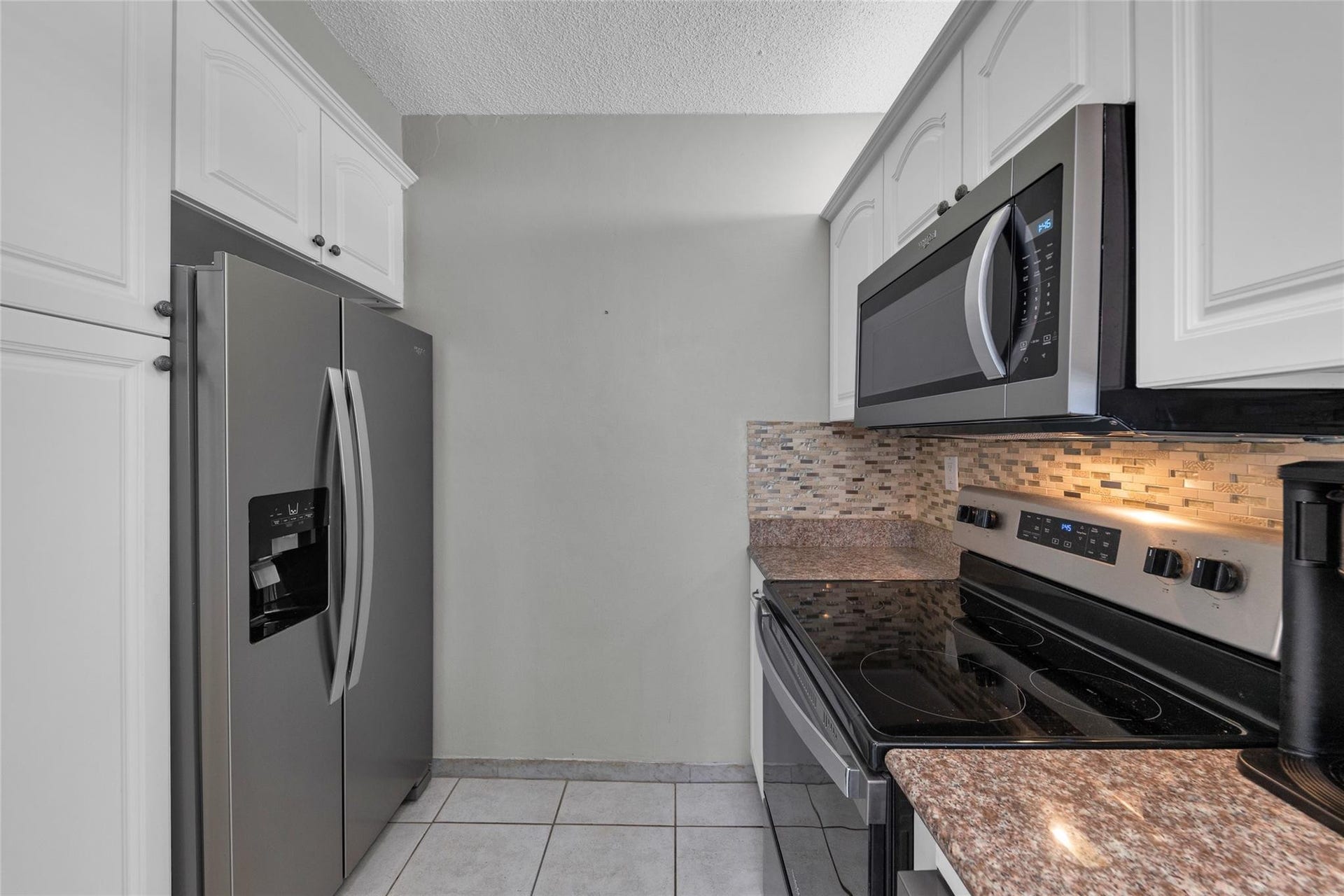 Kitchen with great cabinet space and stainless appliances