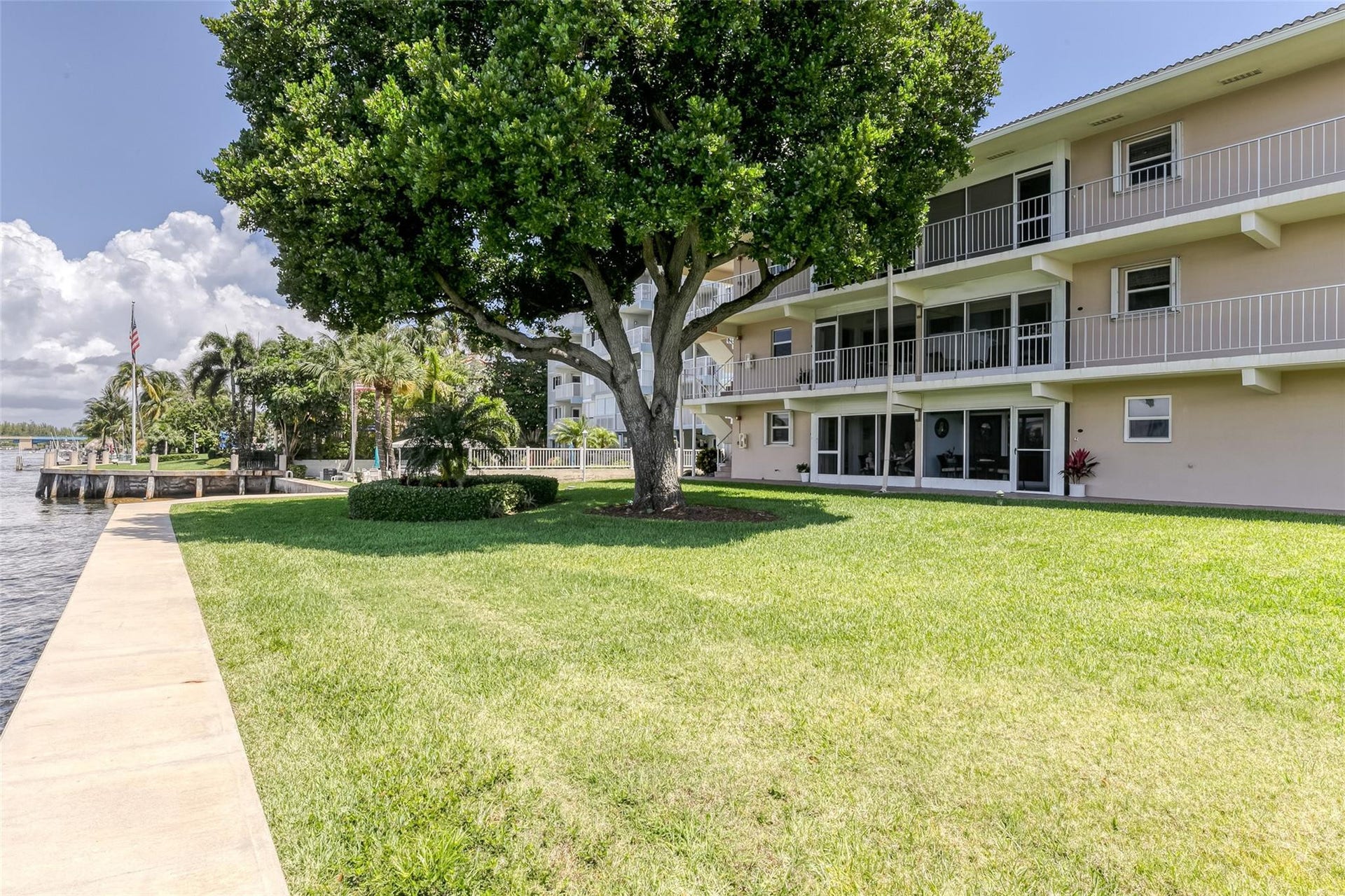 Mature trees and great green space located on the water in Deerfield Beach