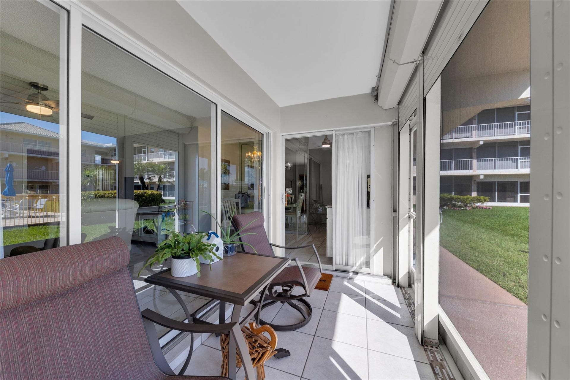 Front patio with sliders into kitchen and into Living room