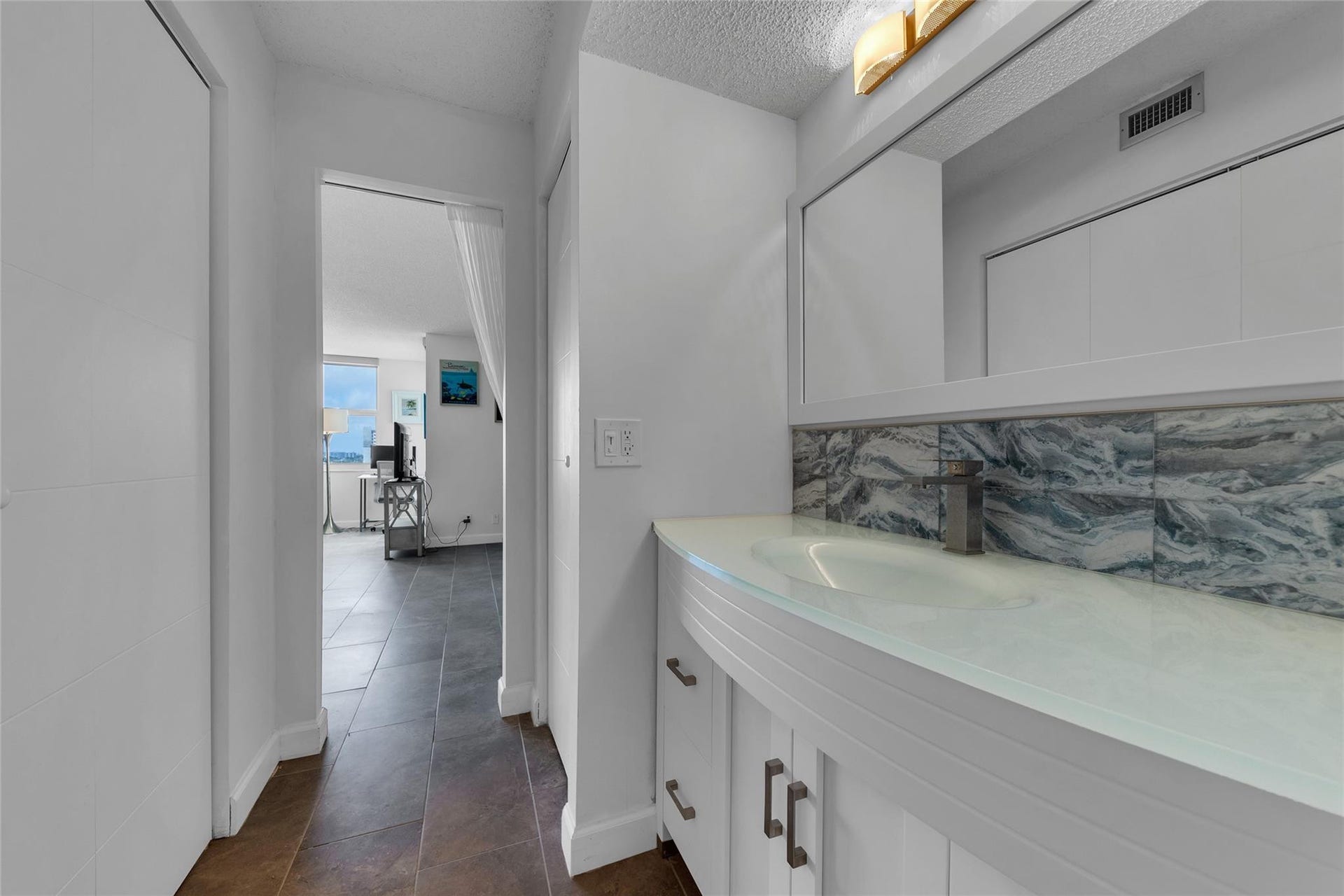 3015 N Ocean Boulevard, #9C, Fort Lauderdale, FL 33308 Updated glass Topped Vanity. Main closet on left. Linen Closet on the right.