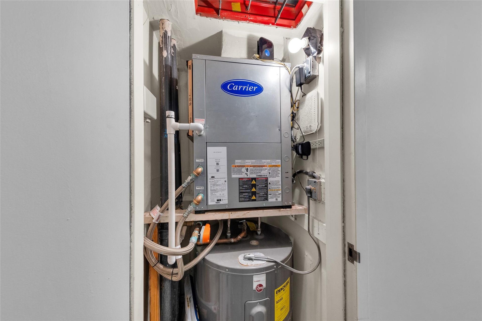 3015 N Ocean Boulevard, #9C, Fort Lauderdale, FL 33308 Newer AC and hot water heater located in a closet outside the unit