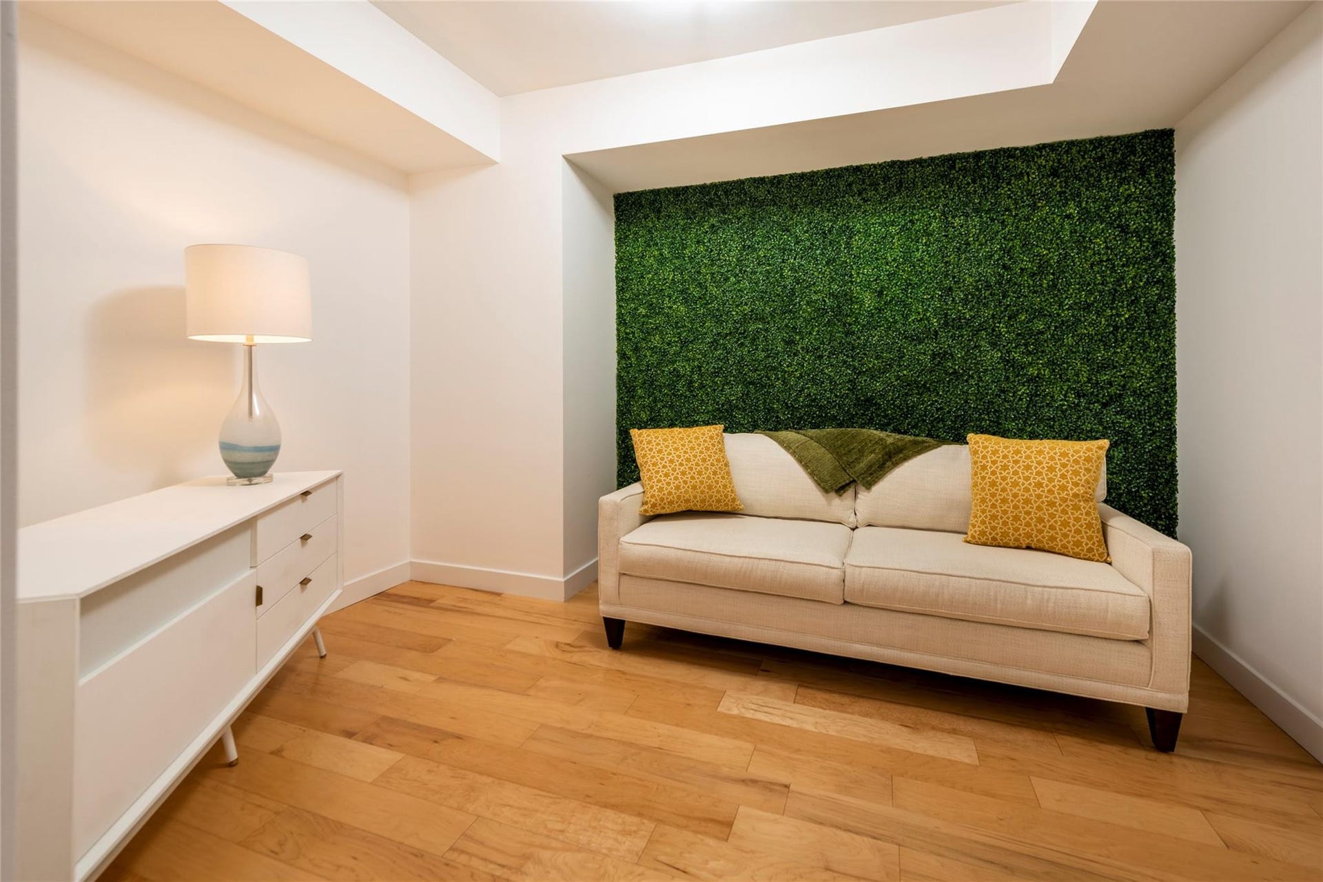 The den features a sleeper sofa