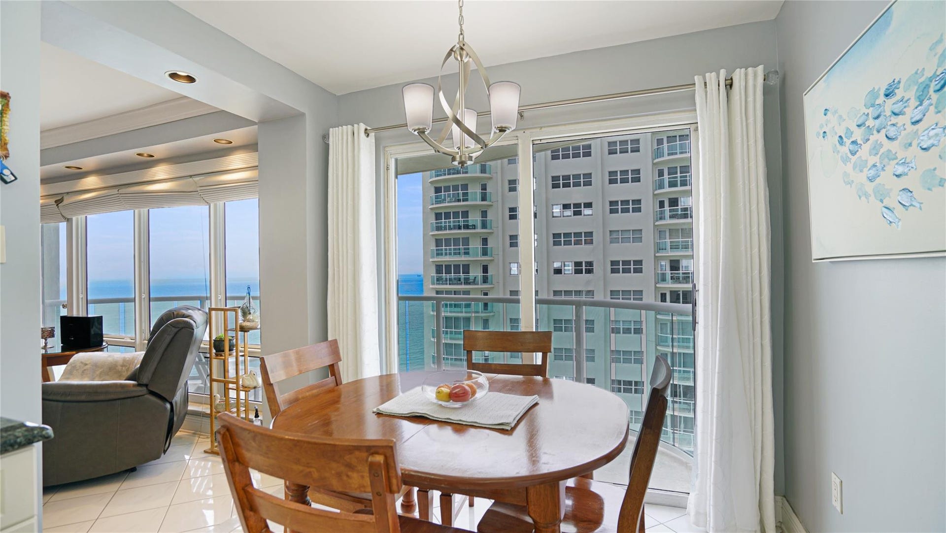 The eat in area has sliding doors that lead out to the balcony.