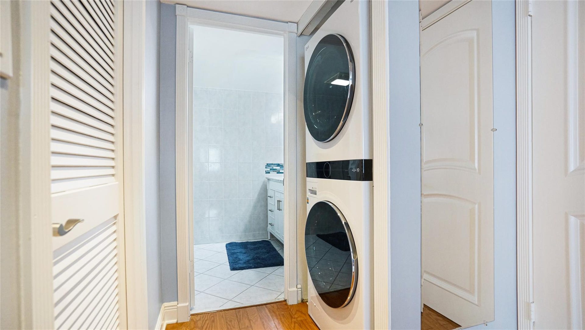 The door on the left leads to the walk in closet. The full size washer and dryer is located just before the second bathroom.