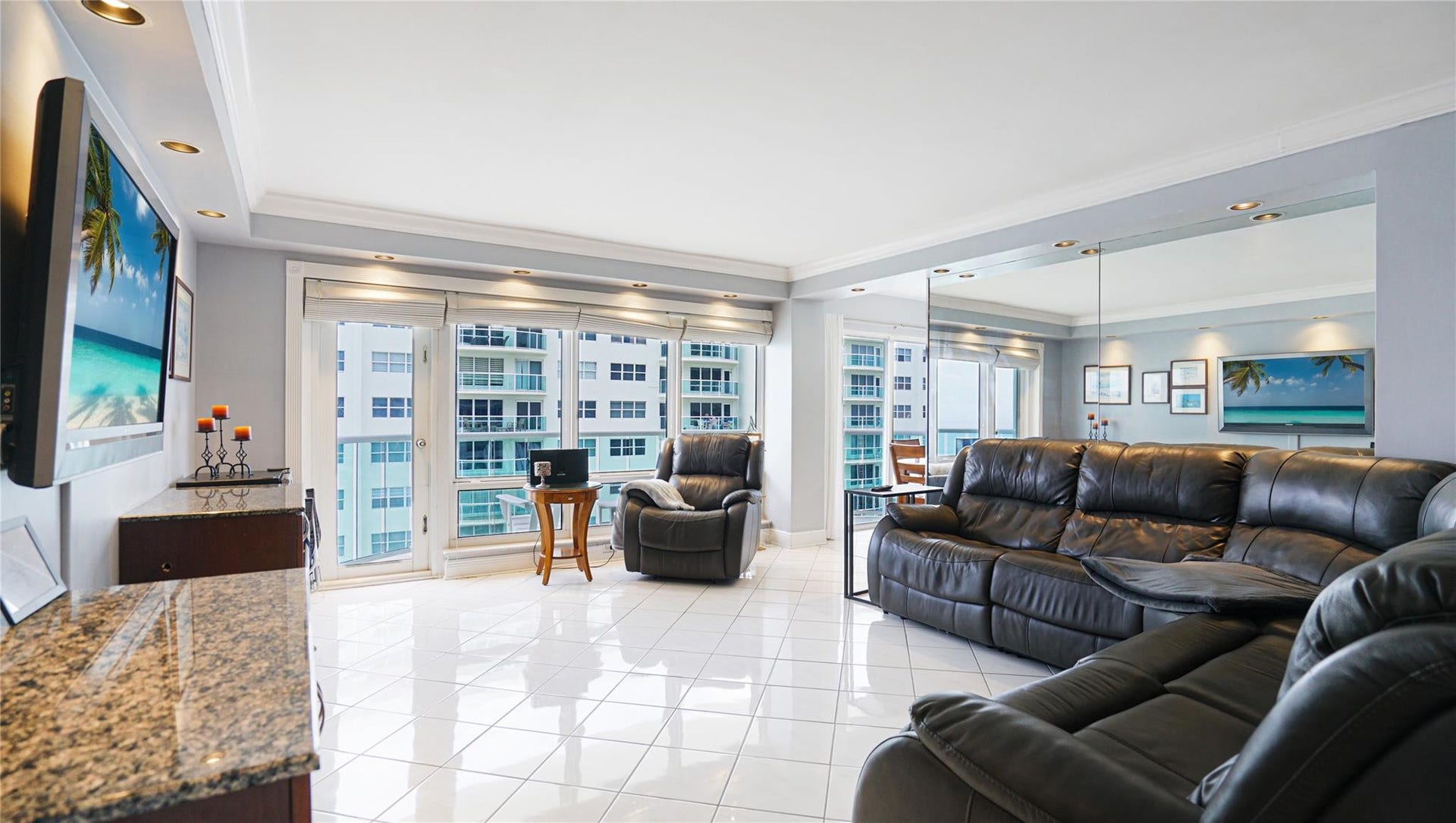 This apartment faces south, so it is sunny and bright. The door on the left leads out to the balcony.