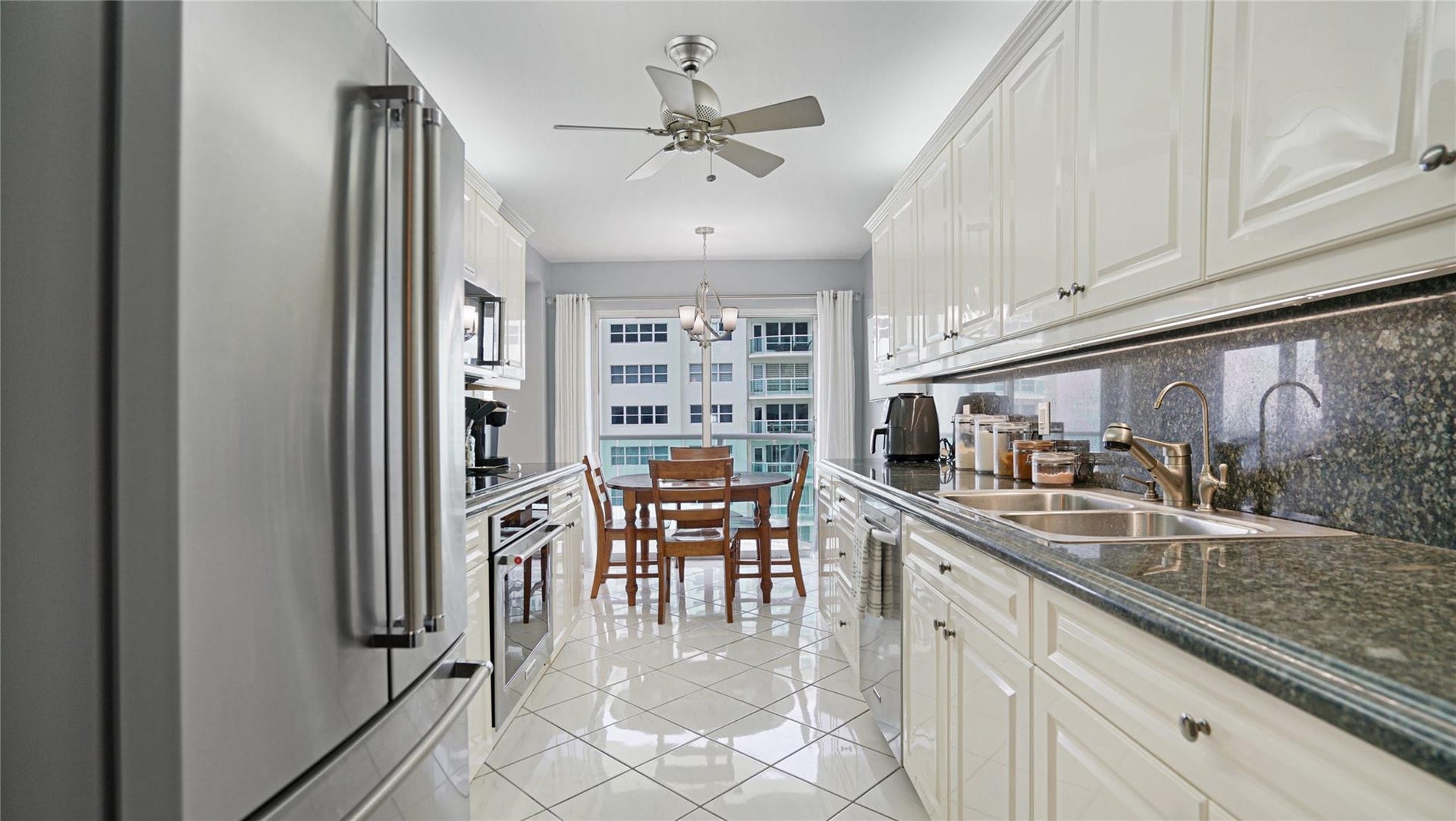 The kitchen features stainless appliances and granite countertops.