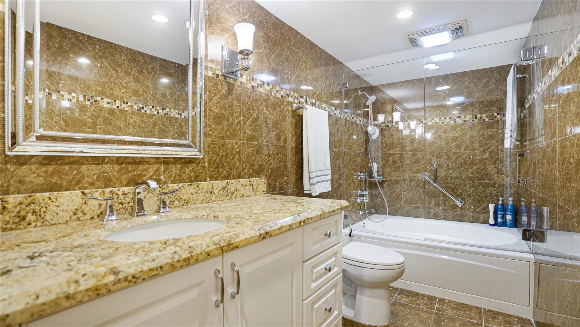This bathroom features a frameless shower door.