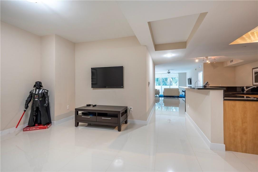 Den to the left, kitchen on the right