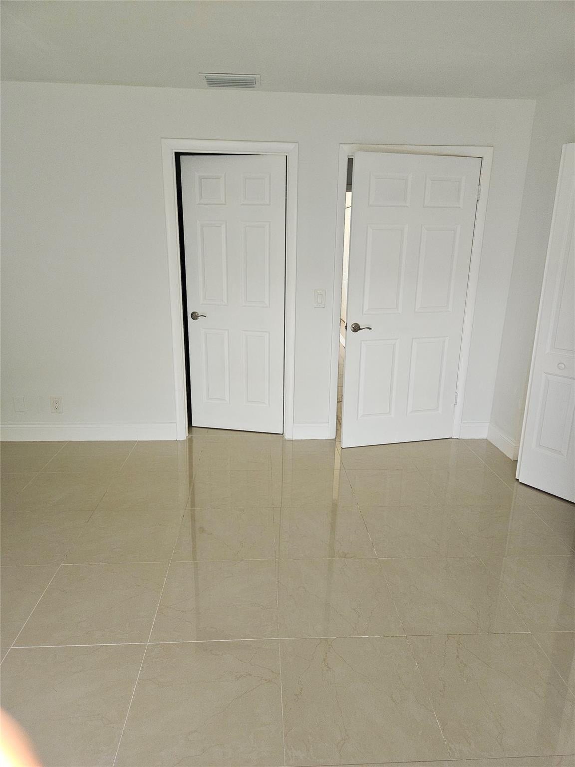 Primary Bedroom/Exit and Bathroom Door