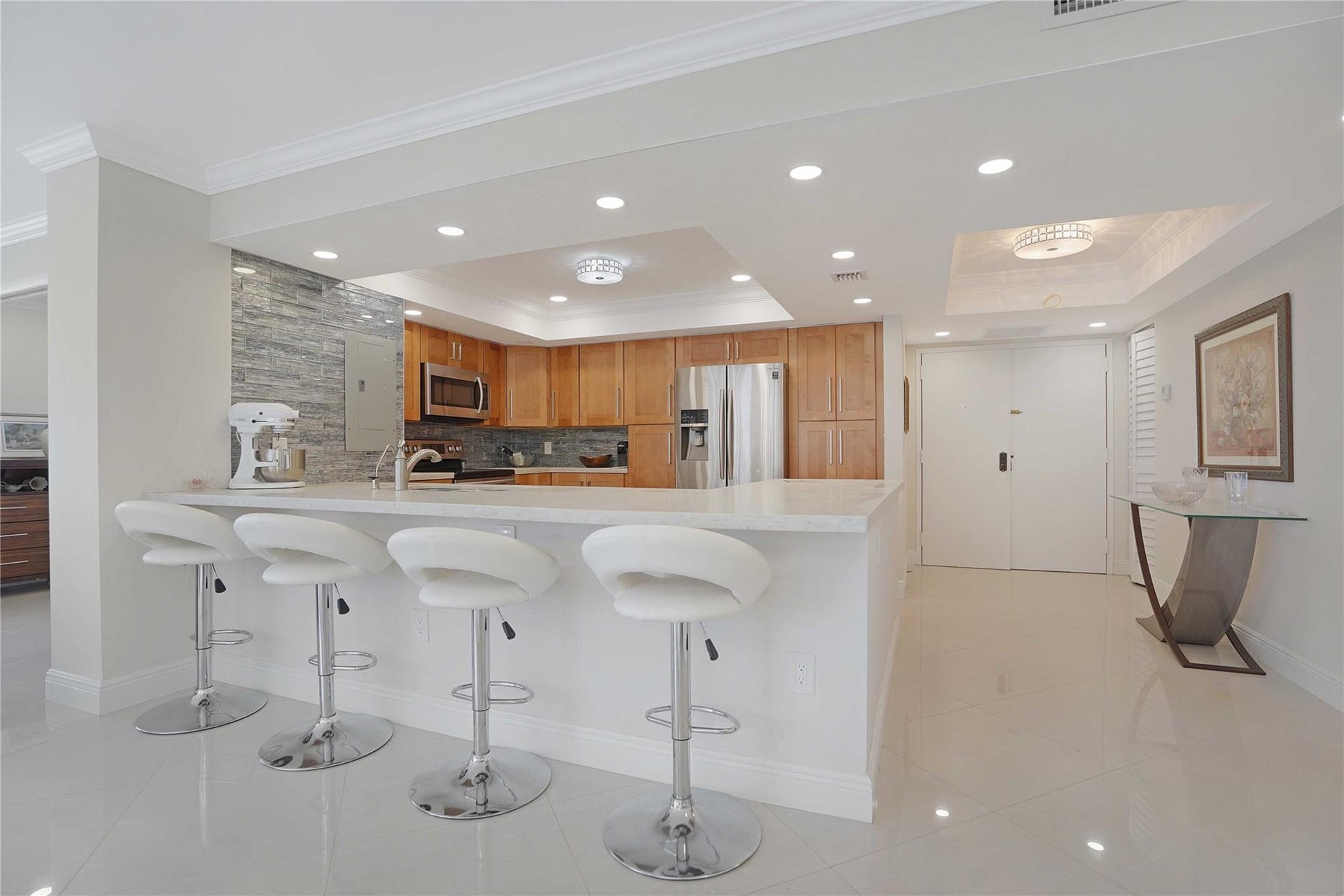 This corner apartment has a double door entry amd counter top seating.