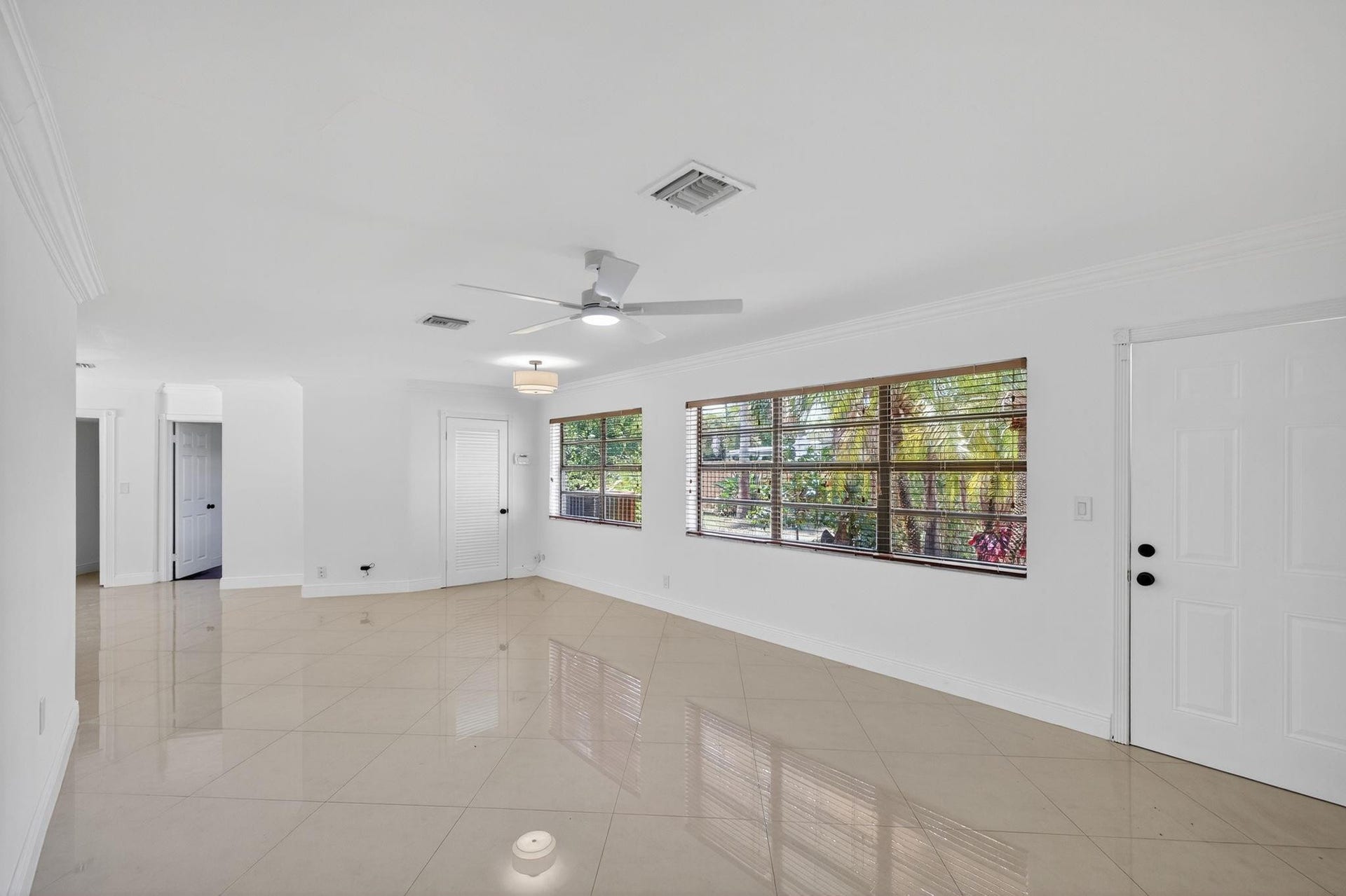 You'll instantly be welcomed with an abundance of natural light which is enhanced by the sleek marble flooring and fresh coat of paint throughout.