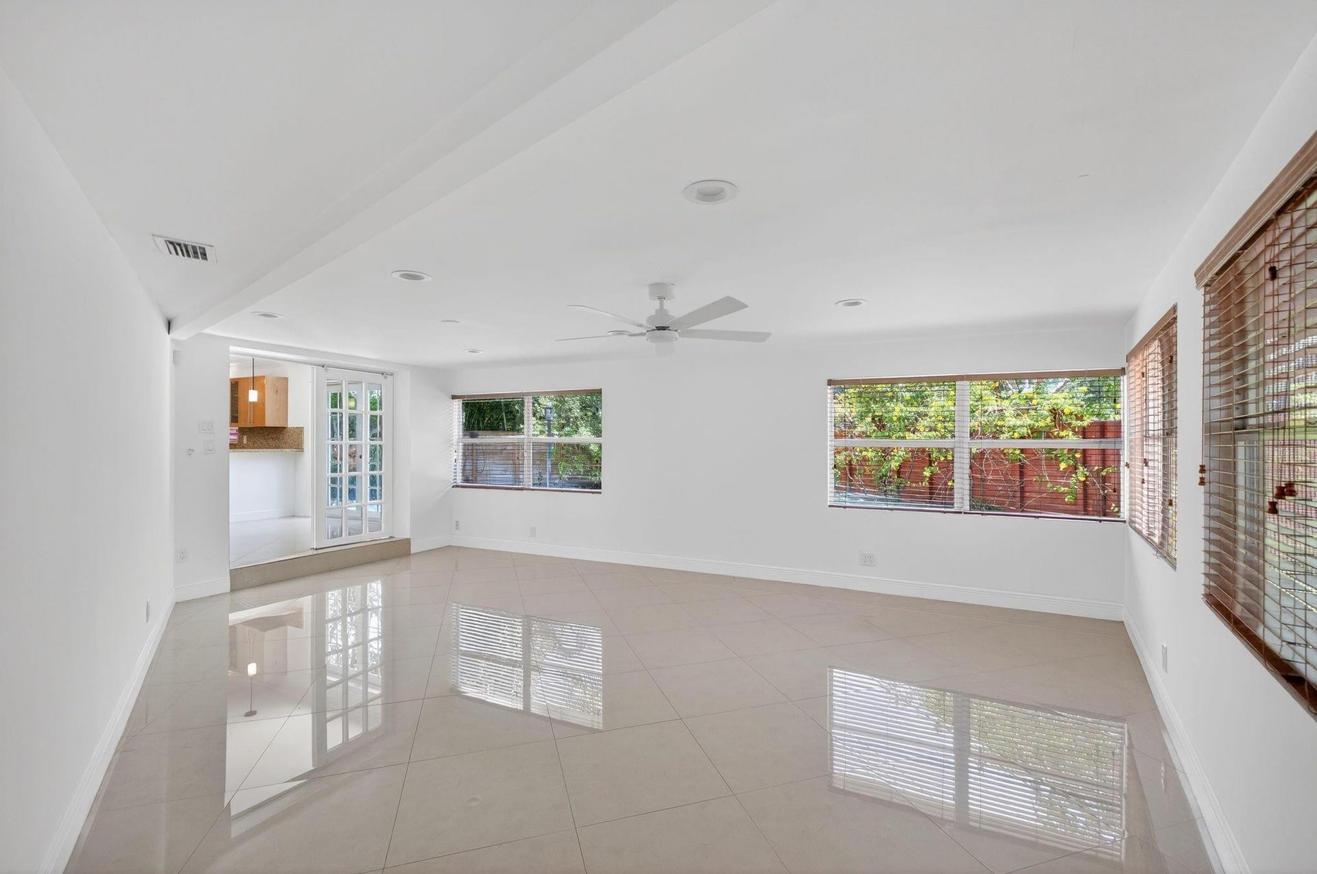 Family Room with access to screened-in patio and backyard