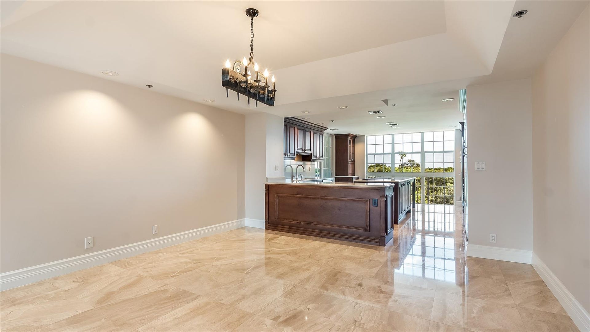 4116 W Palm Aire Drive, #166b, Pompano Beach, FL 33069 Open-concept layout highlights direct access to the kitchen, ideal for effortless hosting and everyday convenience.