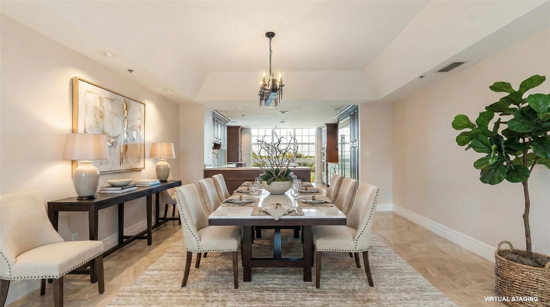 4116 W Palm Aire Drive, #166b, Pompano Beach, FL 33069 Elegant tray ceiling with chandelier lighting defines the dining space, seamlessly connected to the open-concept kitchen. (Virtual Staging)