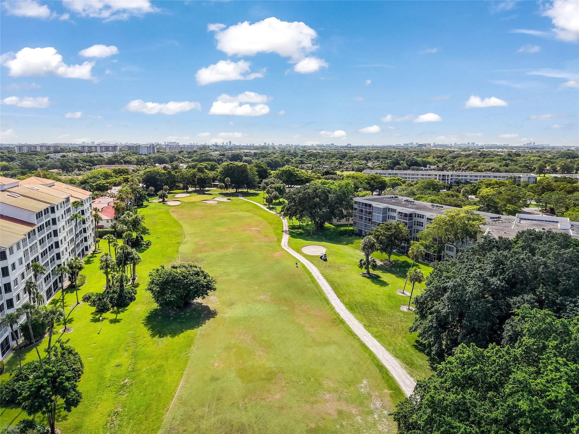 4116 W Palm Aire Drive, #166b, Pompano Beach, FL 33069 Expansive fairway views offer a tranquil backdrop with scenic landscaping and mature trees throughout the community.