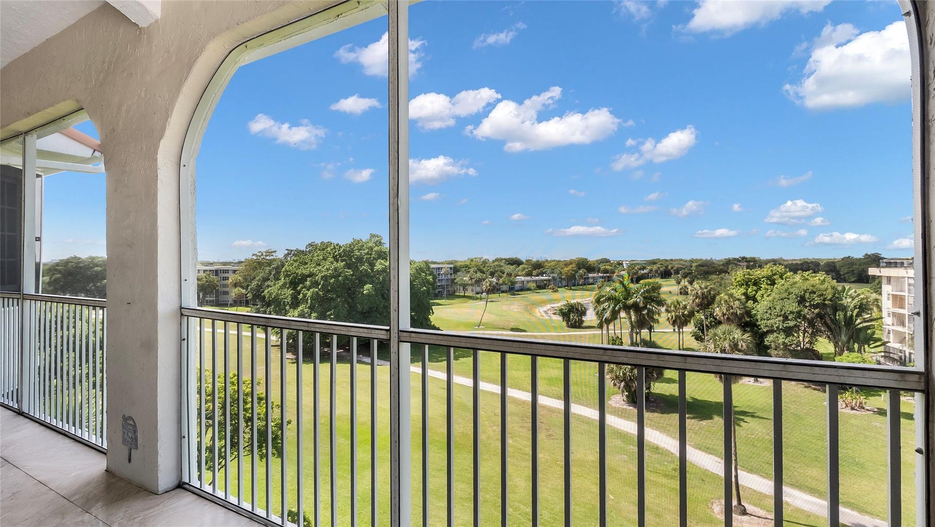 4116 W Palm Aire Drive, #166b, Pompano Beach, FL 33069 Enjoy serene golf course views from the spacious screened-in balcony, ideal for relaxing or entertaining year-round.