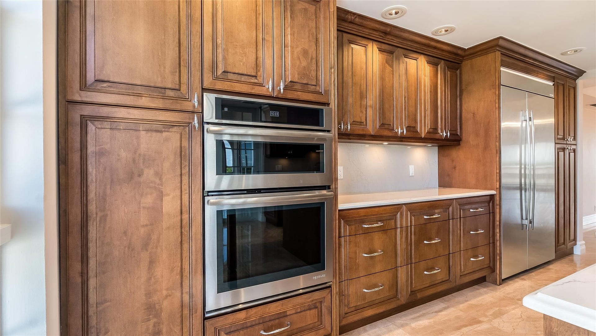 4116 W Palm Aire Drive, #166b, Pompano Beach, FL 33069 Double wall ovens and expansive cabinetry provide abundant storage and a seamless, integrated look.