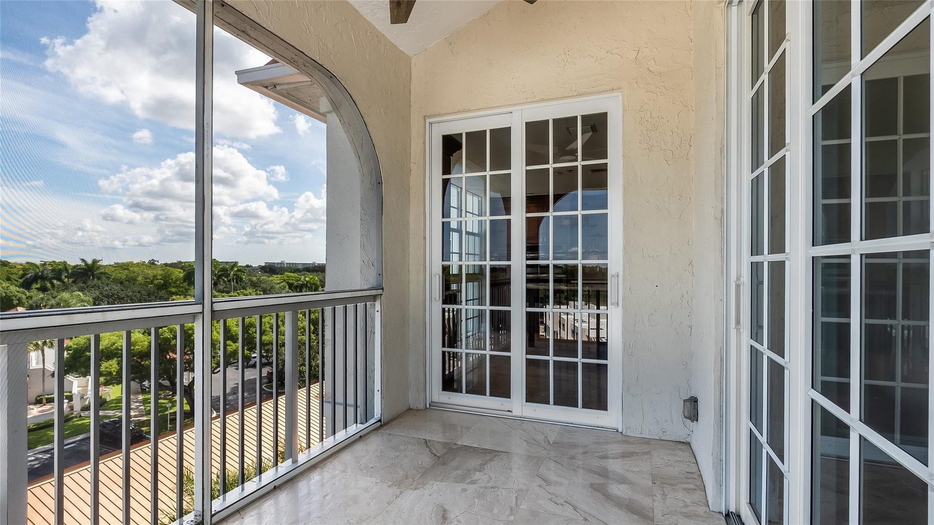 4116 W Palm Aire Drive, #166b, Pompano Beach, FL 33069 French doors open directly to the balcony, creating an airy indoor-outdoor connection.