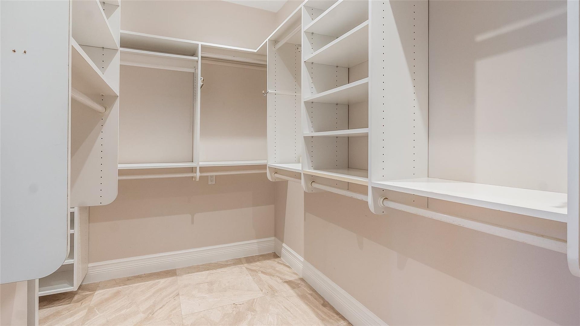 4116 W Palm Aire Drive, #166b, Pompano Beach, FL 33069 Primary Bed: Custom built-in shelving and hanging systems provide ample storage and organization options.