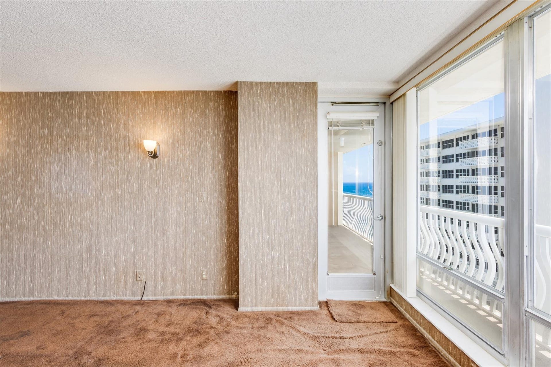 with picture windows andn door to balcony