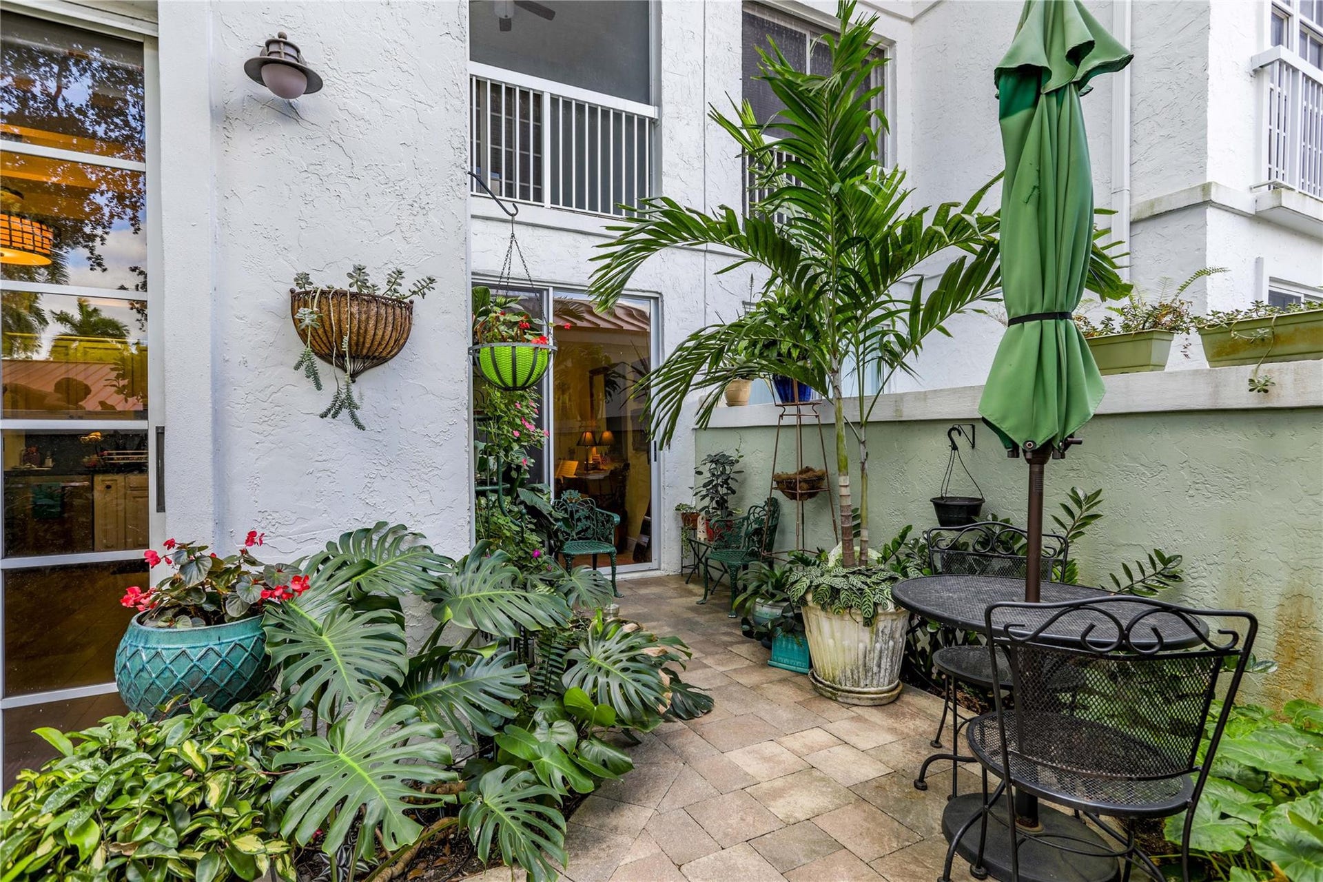 4112 W Palm Aire Drive, #121B, Pompano Beach, FL 33069 Private patio with multiple sitting areas