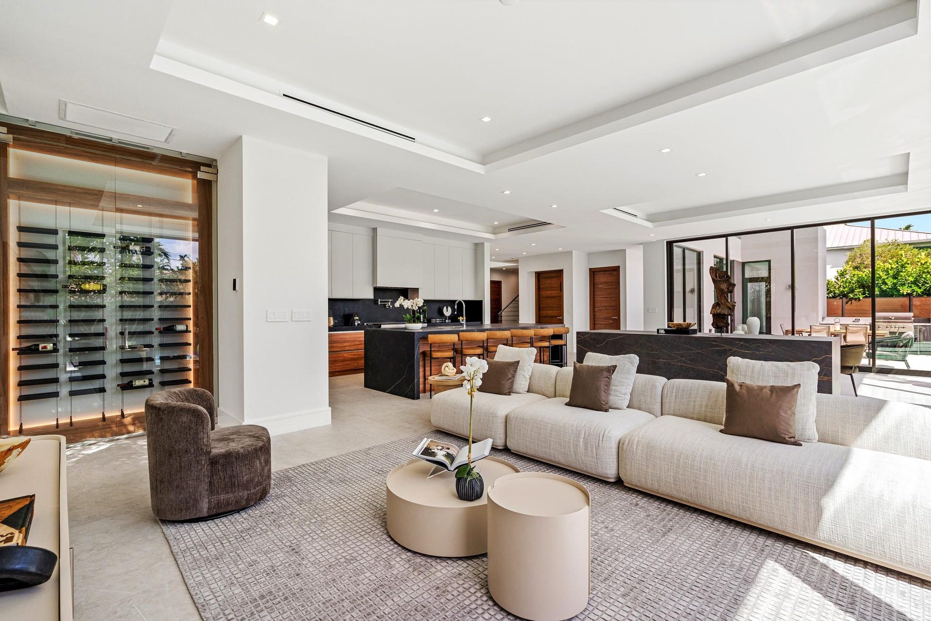 2000 Harbourview Drive, Fort Lauderdale, FL 33316 A refined open living area featuring clean architectural lines, custom millwork, and a seamless transition into the designer kitchen beyond. Bright and impeccably styled, this contemporary space is crafted for relaxed luxury and effortless entertaining.