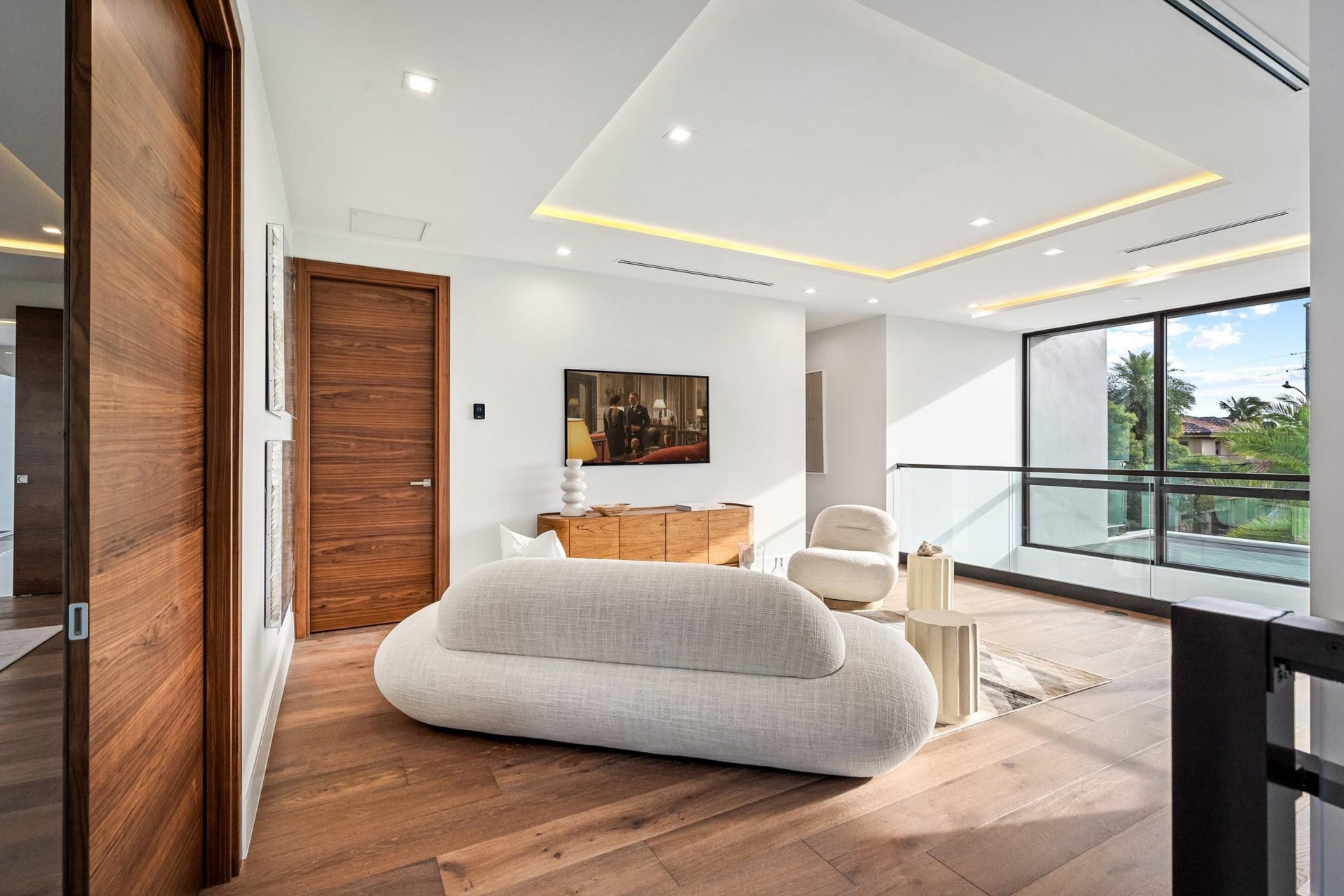 2000 Harbourview Drive, Fort Lauderdale, FL 33316 A serene modern bedroom retreat featuring clean architectural lines, a low-profile platform bed, and expansive windows framing tranquil water views. Minimalist yet warm, this private sanctuary blends contemporary design with effortless coastal elegance.
